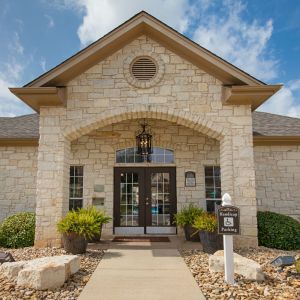 Riviera Apartments in Waco, TX community leasing office building exterior showing the office entrance