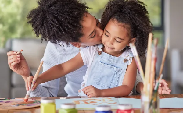 Riviera Apartments with a mother and daughter painting happily at home